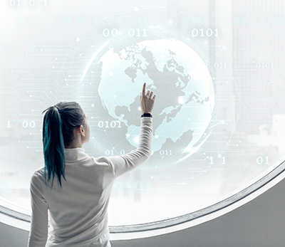 Researcher spinning a globe on a round screen 