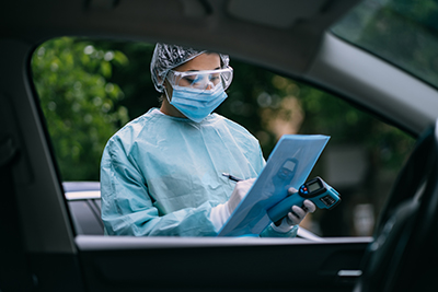 nurse wears protective suit mask during covid19 outbreak